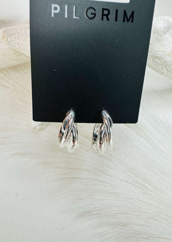 COURAGEOUS TWIRL HUGGIE HOOP EARRINGS